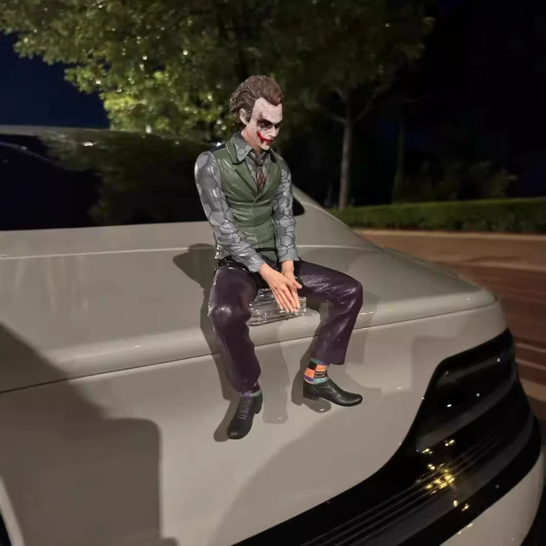 Joker figure seated pose