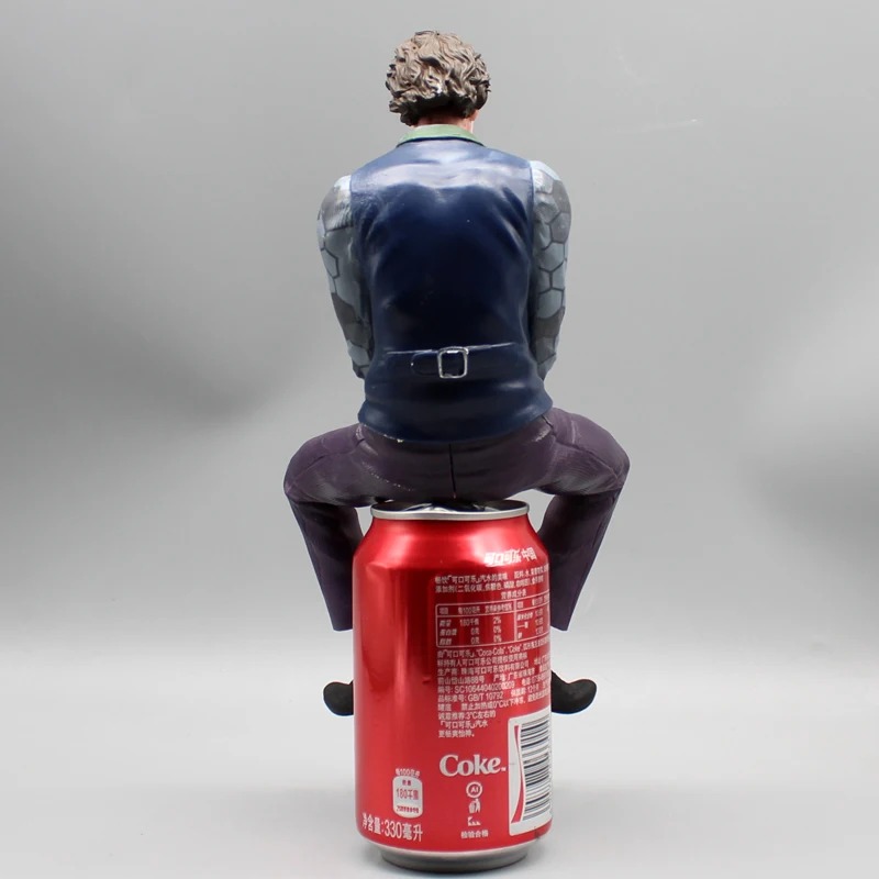 Back view of the seated Joker figure