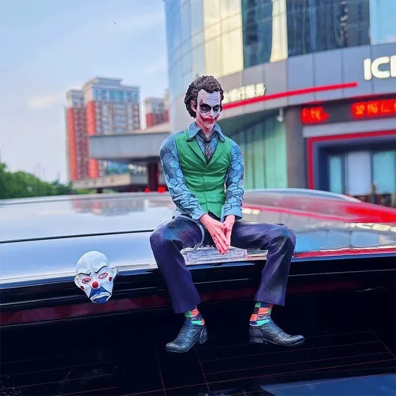 Joker figure displayed on a car